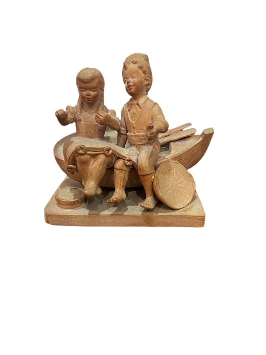 Statuette 2 enfants sur barque signé Ana Alexandre