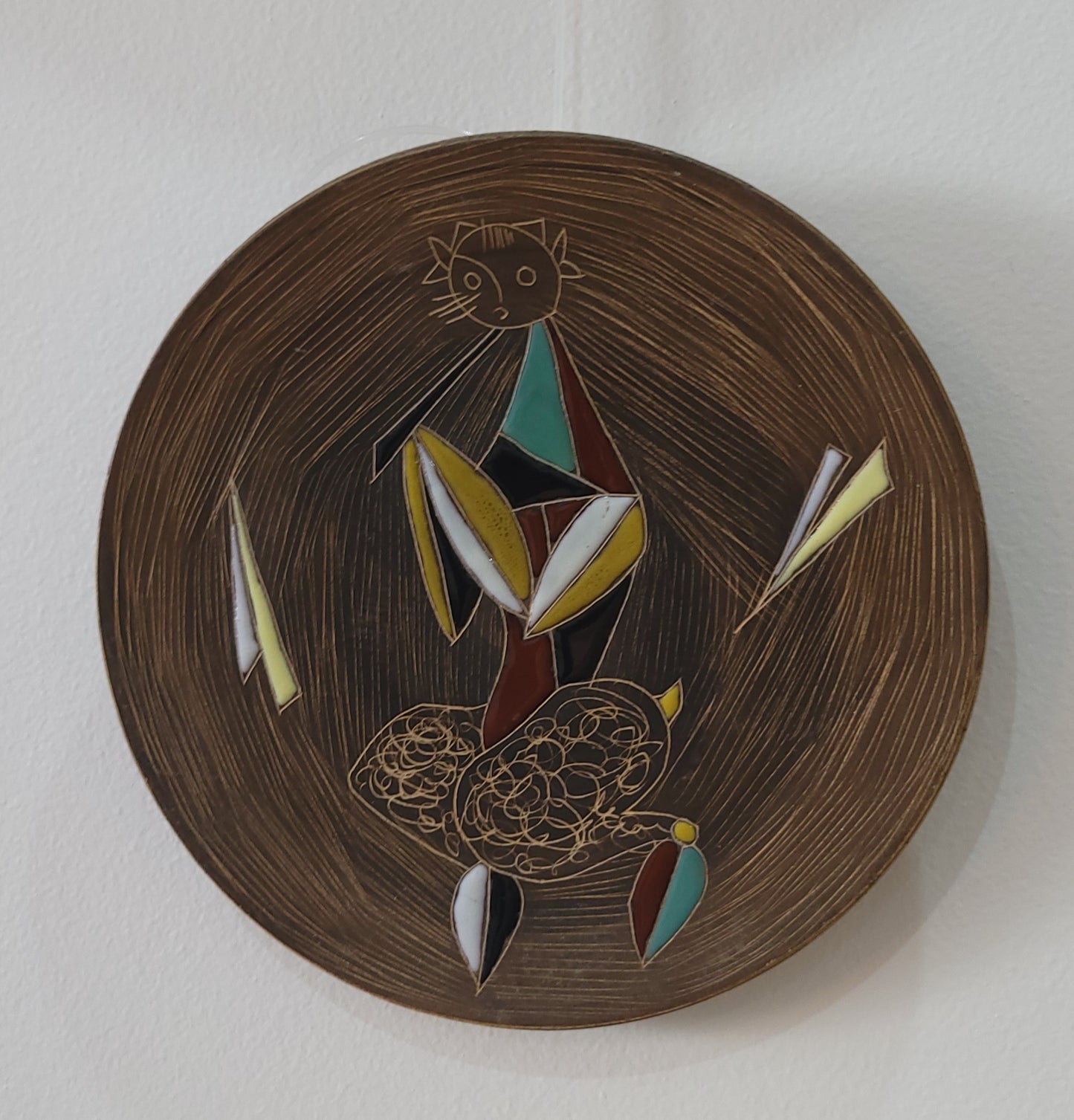 Assiette murale en terre cuite émaillée